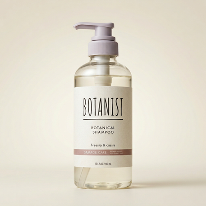 BOTANIST Botanical Shampoo Damage Care 460ml minimalist clear bottle with black pump and silver-grey labeling, Japanese professional plant-derived repairing hair cleanser.