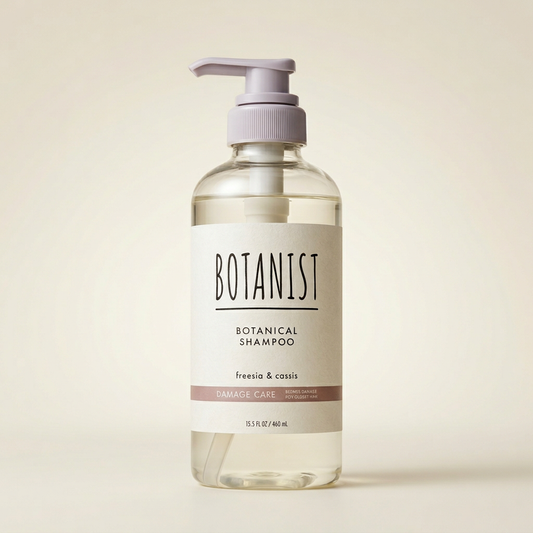 BOTANIST Botanical Shampoo Damage Care 460ml minimalist clear bottle with black pump and silver-grey labeling, Japanese professional plant-derived repairing hair cleanser.